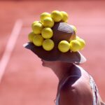 Tennis fan turns heads with ball hat during French Open