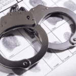 Police charge suspect filmed senselessly beating an elderly woman in tavern
